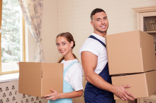 Loading household furniture and boxes into a moving van in Hampstead